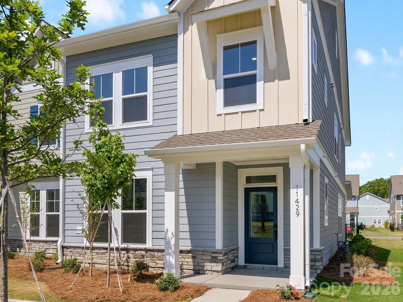 Exterior details and patio area of a home in North Creek Village - Townhomes, Huntersville (Image 3). Exterior details and patio area of a home in North Creek Village - Townhomes, Huntersville (Image 3).