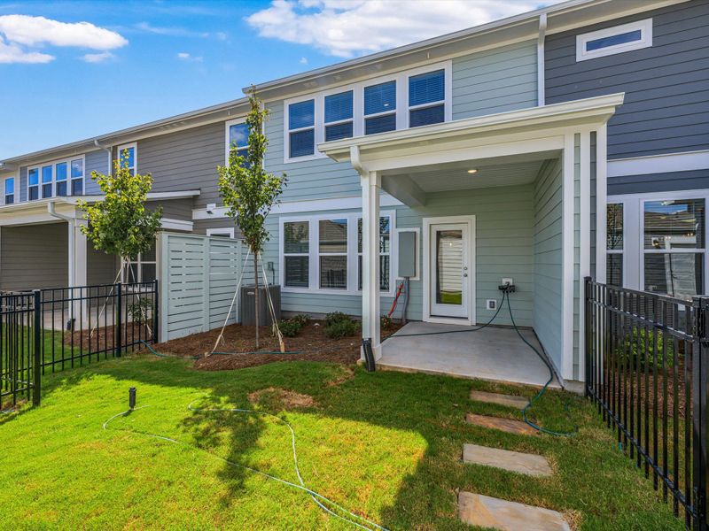 Exterior details and patio area of a home in North Creek Village - Townhomes, Huntersville (Image 3).