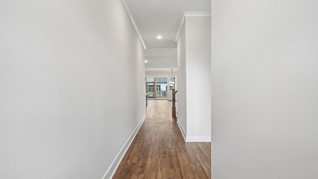 Entry hallway to home with bedroom on the right