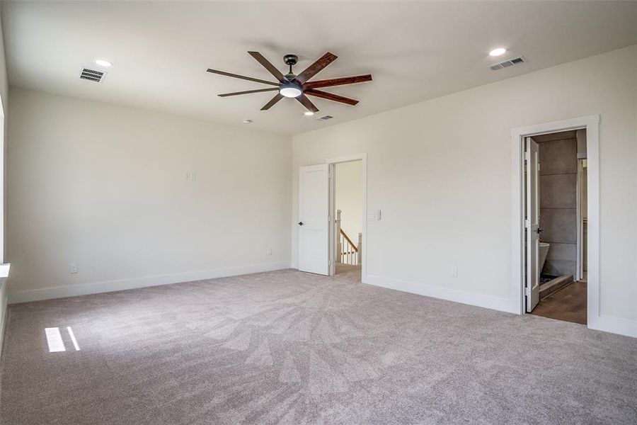 Unfurnished bedroom with carpet, recessed lighting, ensuite bath, and a ceiling fan