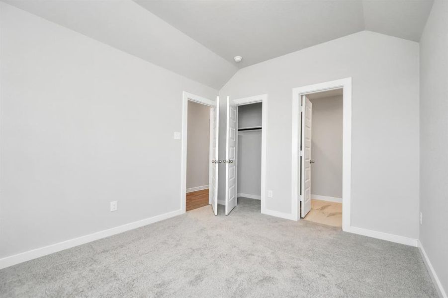 Another view of the guest suite, situated at the front of the home. Sample photo of completed home with similar floor plan. As-built interior colors and selections may vary.