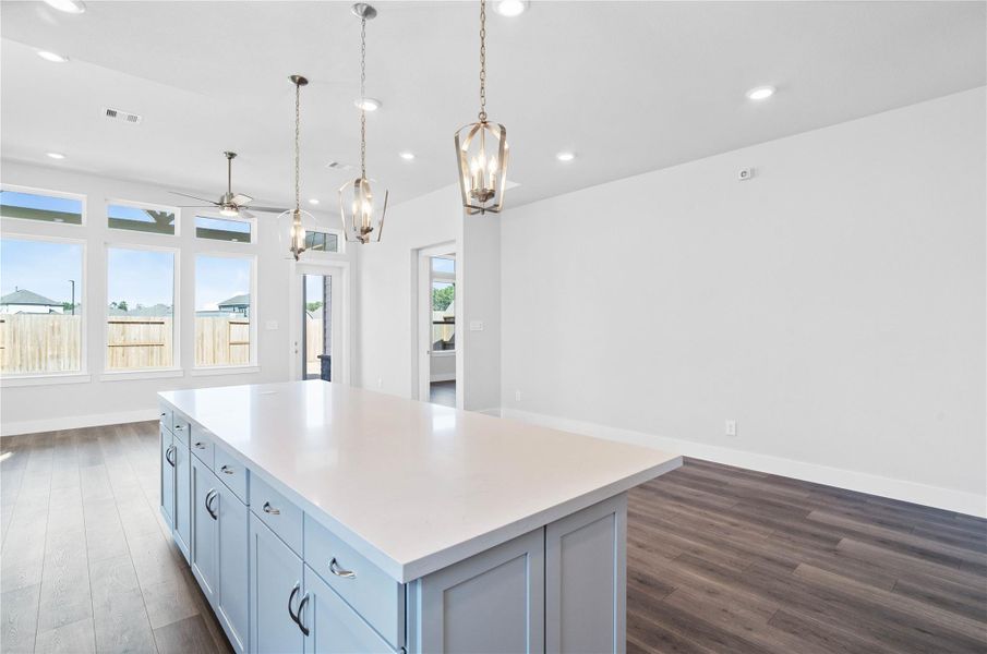The intentional open design fosters a deep sense of connection between all three primary living zones. Sightlines remain clear from the sink to the sofa, promoting inclusive living and effortless entertaining. The intentional open design fosters a deep sense of connection between all three primary living zones. Sightlines remain clear from the sink to the sofa, promoting inclusive living and effortless entertaining.