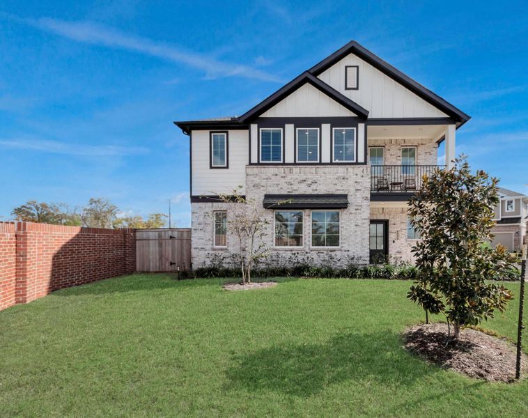 Front exterior of a new home in Sienna, Missouri City, TX, highlighting curb appeal (Image 2).
