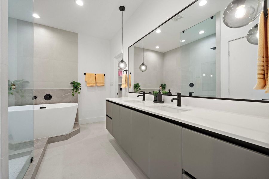 This modern vanity features a sleek, double-sink design with ample space for two. Clean lines and high-end finishes create a stylish, functional space, perfect for sharing while maintaining a clutter-free, organized look.*Images shown are from a similar model. Actual features may vary. This modern vanity features a sleek, double-sink design with ample space for two. Clean lines and high-end finishes create a stylish, functional space, perfect for sharing while maintaining a clutter-free, organized look.*Images shown are from a similar model. Actual features may vary.