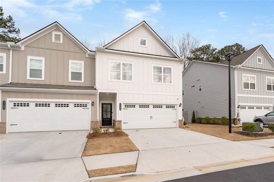 Front exterior of a new home in , Sugar Hill, GA, highlighting curb appeal (Image 22).