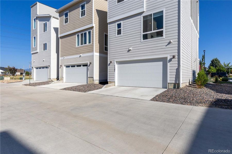 Front exterior of a new home in Haskins Station, Arvada, CO, highlighting curb appeal (Image 1). Front exterior of a new home in Haskins Station, Arvada, CO, highlighting curb appeal (Image 1).