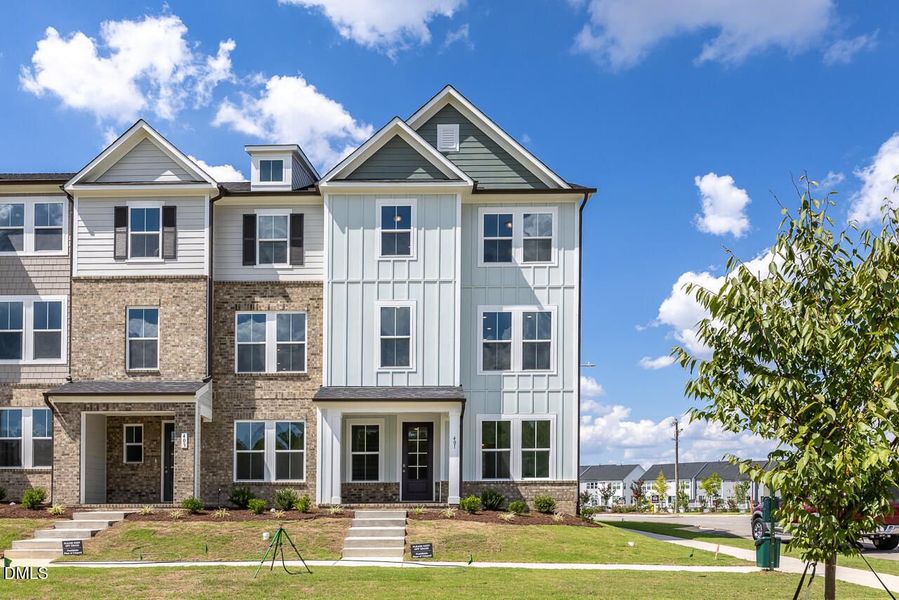 Front exterior of a new home in Forestville Yard Townhomes, Knightdale, NC, highlighting curb appeal (Image 2). Front exterior of a new home in Forestville Yard Townhomes, Knightdale, NC, highlighting curb appeal (Image 2).