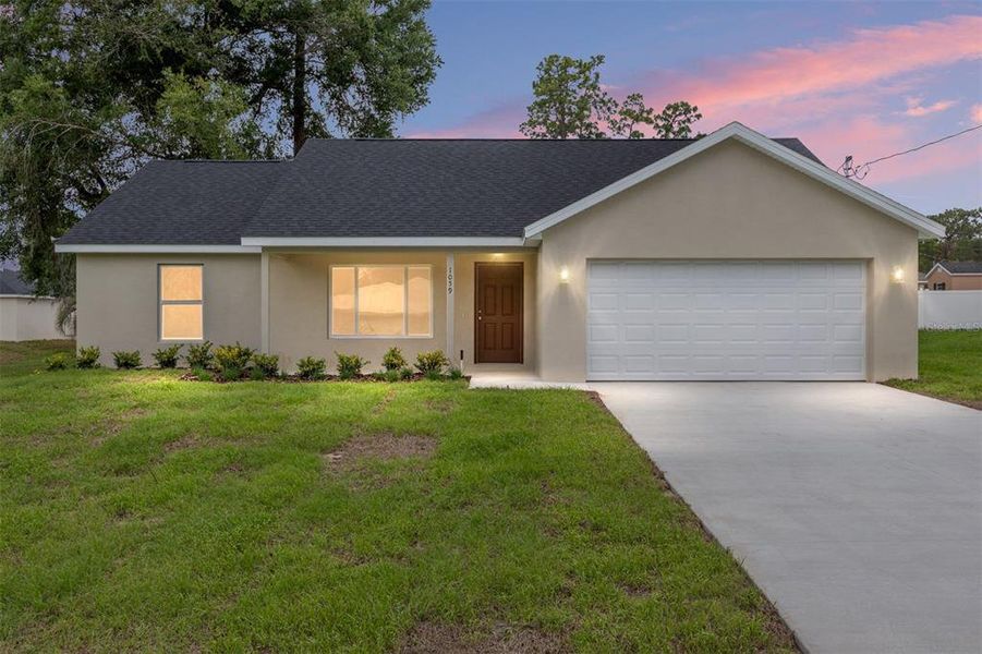 Front exterior of a new home in , Ocklawaha, FL, highlighting curb appeal (Image 18).