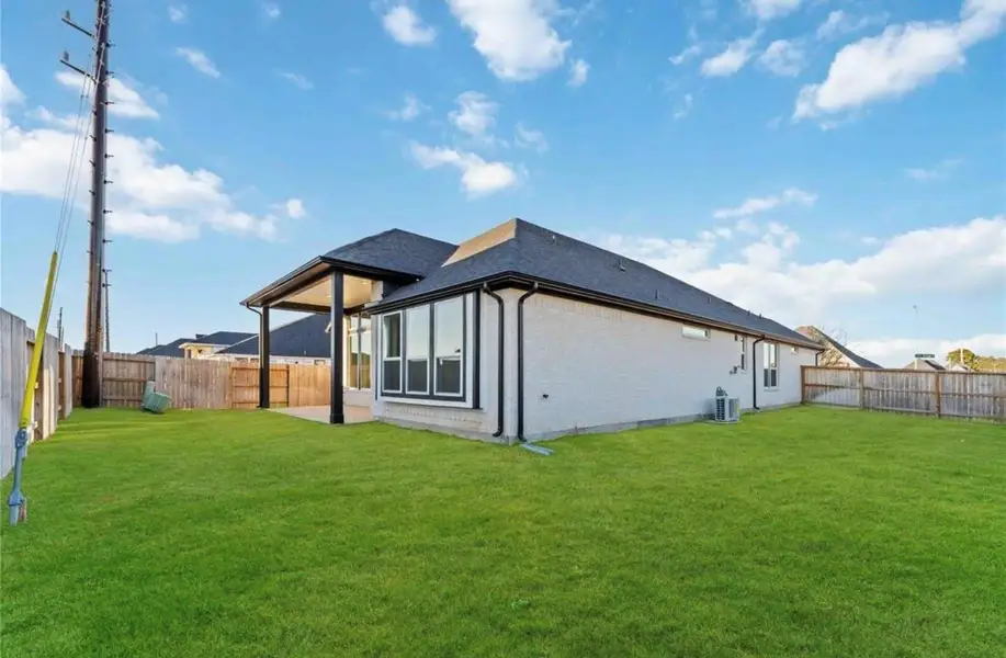 Exterior details and patio area of a home in Arabella on the Prairie, Booth (Image 4).
