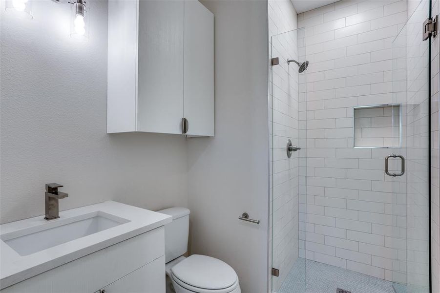 Photos are of unit #204. Unit #101 will feature white cabinets and grey wood floors. Photos are of unit #204. Unit #101 will feature white cabinets and grey wood floors.