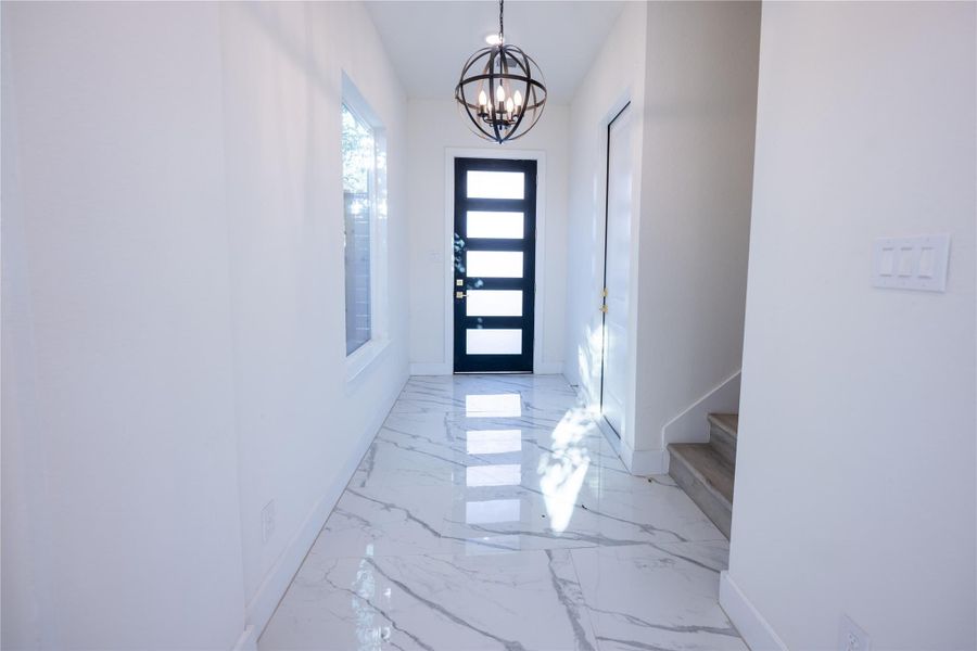 Flooded with natural sunlight, this home invites you into a bright, open floor plan accented by high ceilings. Flooded with natural sunlight, this home invites you into a bright, open floor plan accented by high ceilings.