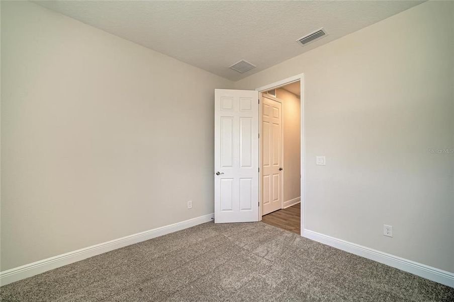 Spacious, unfurnished interior of a new home in Pasadena Ridge, Dade City (Image 28).