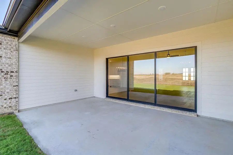 Exterior details and patio area of a home in Waterfall Ranch, Waxahachie (Image 2).