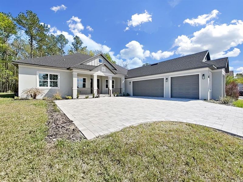 Front exterior of a new home in Southern Hills Plantation, Brooksville, FL, highlighting curb appeal (Image 25).
