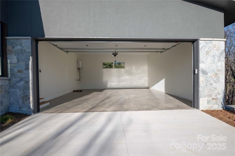 Garage generously sized with 18' garage door. Garage generously sized with 18' garage door.