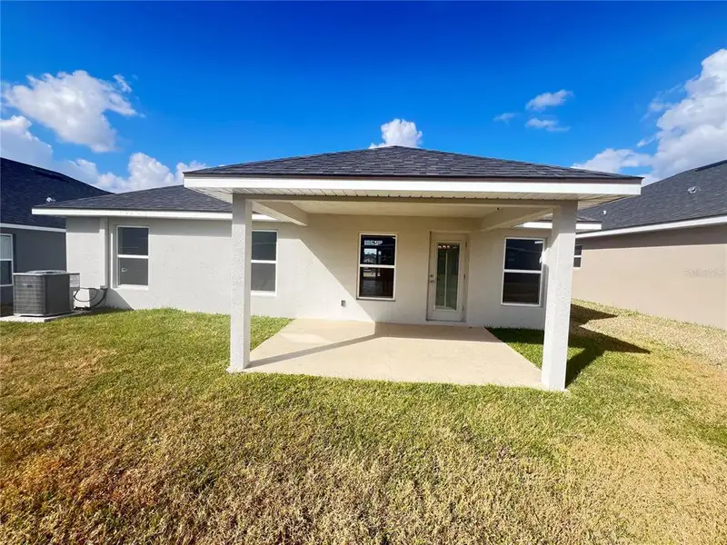 Exterior details and patio area of a home in , Dade City (Image 3).