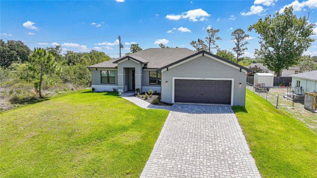 Front exterior of a new home in , Port Charlotte, FL, highlighting curb appeal (Image 2). Front exterior of a new home in , Port Charlotte, FL, highlighting curb appeal (Image 2).
