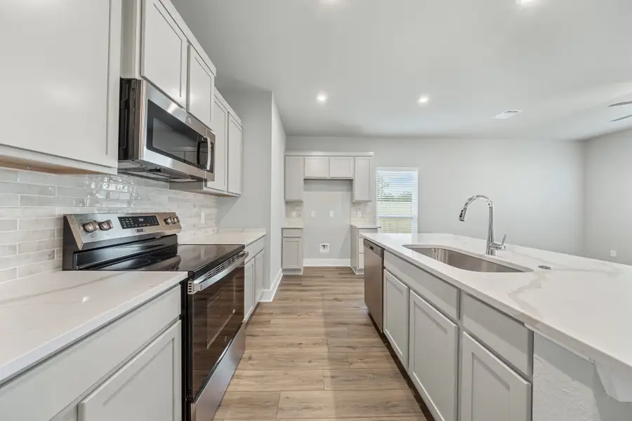 Representative furnished interior of a home built from the Caden by Omega Builders in North Point, Temple (Image 7).
