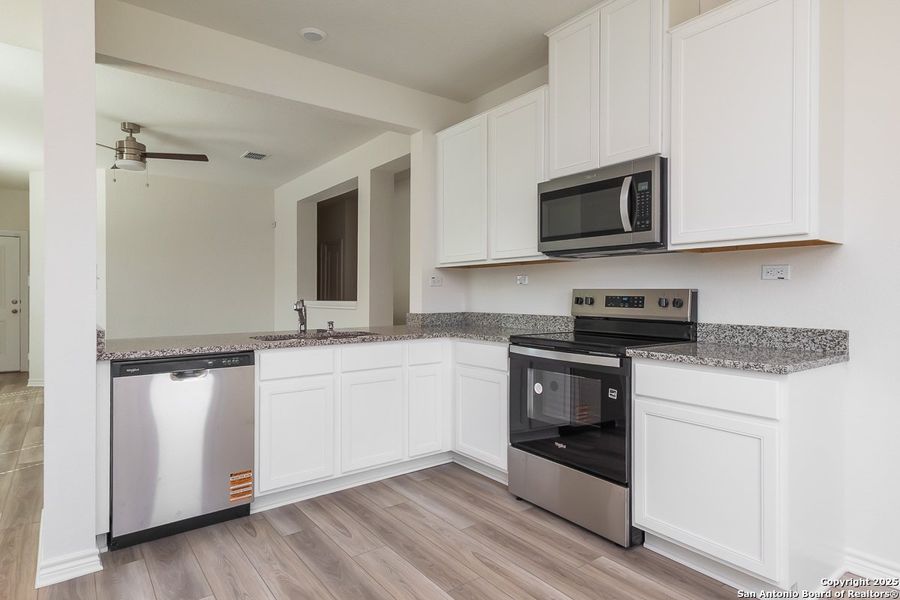 Furnished interior view inside a new home in Woodside Farms, Seguin (Image 3).