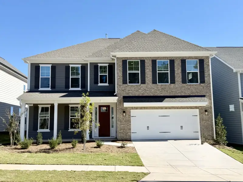Front exterior of a new home in Sweetbrier, Durham, NC, highlighting curb appeal (Image 1). Front exterior of a new home in Sweetbrier, Durham, NC, highlighting curb appeal (Image 1).