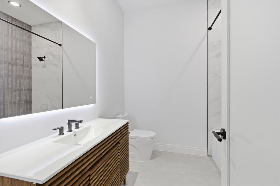 Shared hallway bath downstairs.