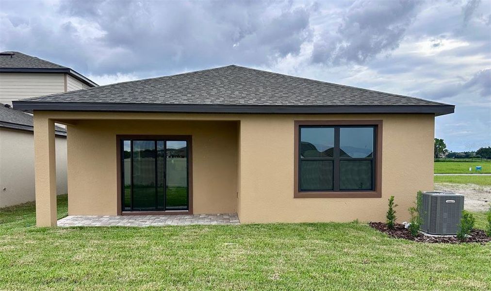 Front exterior of a new home in Grasslands West, Lakeland, FL, highlighting curb appeal (Image 15).