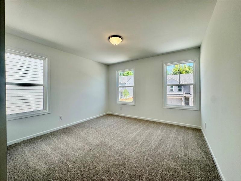 Spacious, unfurnished interior of a new home in Eastlyn Crossing, Flowery Branch (Image 22).