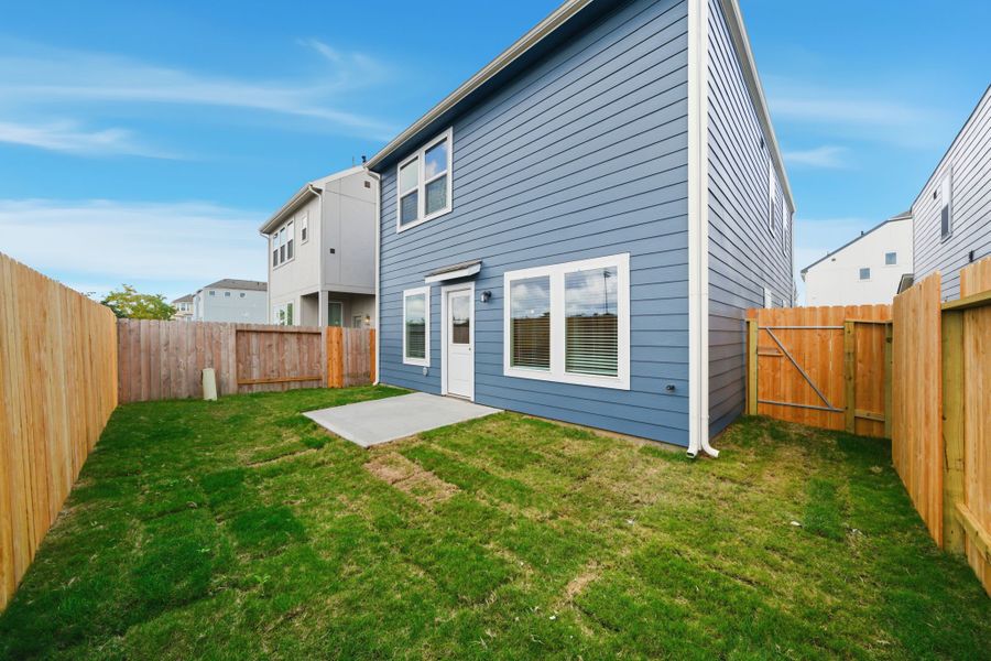 A house with a fence around it. A house with a fence around it.