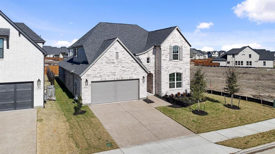 Front exterior of a new home in Brookhollow West, Prosper, TX, highlighting curb appeal (Image 22).
