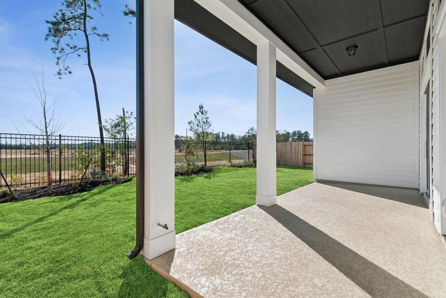 Exterior details and patio area of a home in ARTAVIA - Enclave Collection, Conroe (Image 3).