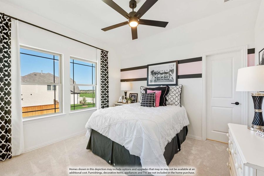 Bedroom with ceiling fan, carpet flooring, large windows, and black-and-white decor accents Bedroom with ceiling fan, carpet flooring, large windows, and black-and-white decor accents
