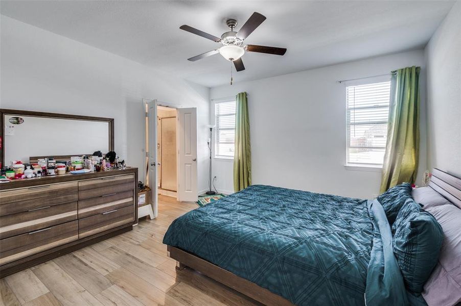 Bedroom featuring light wood-type flooring and ceiling fan