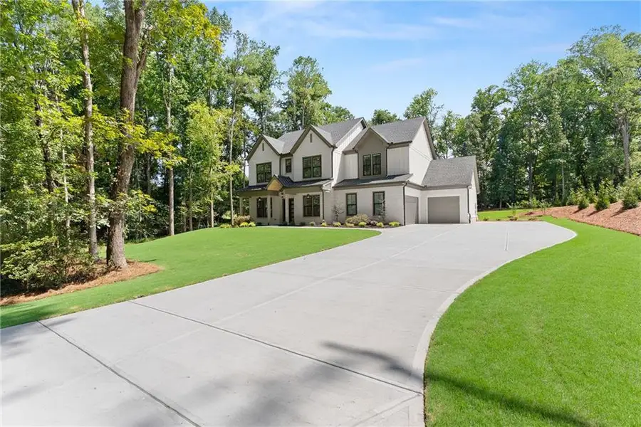 Front exterior of a new home in , Cumming, GA, highlighting curb appeal (Image 27).