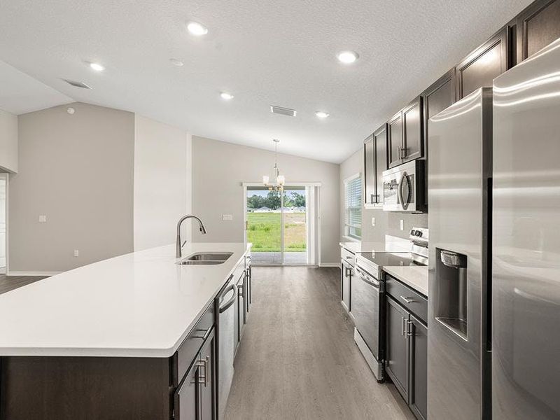 Dine at the island or the sunny adjacent dining cafe.