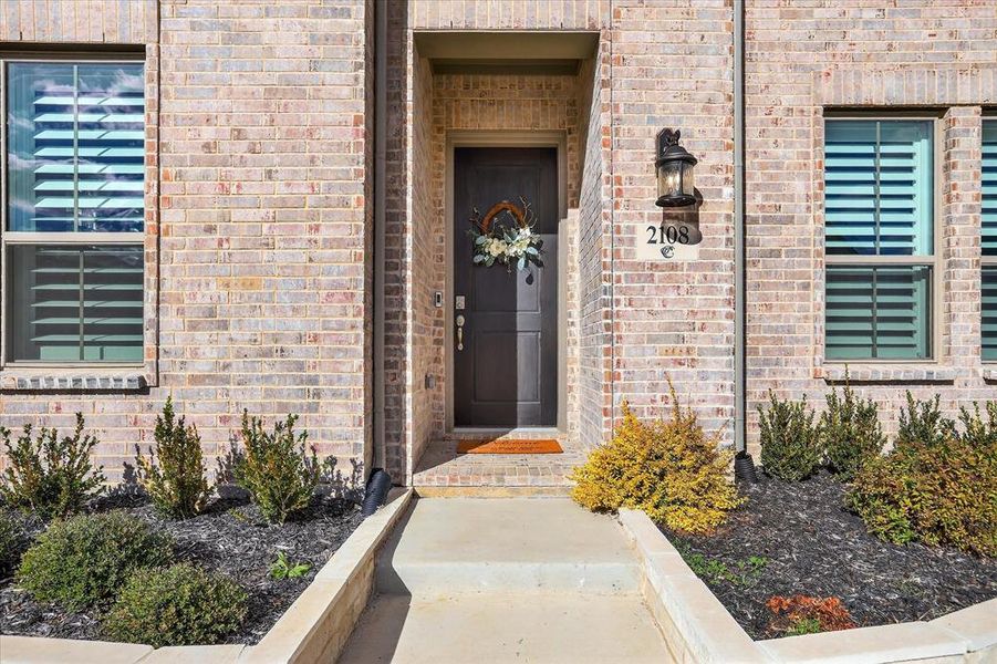 Exterior details and patio area of a home in Pecan Square 40', Northlake (Image 3).