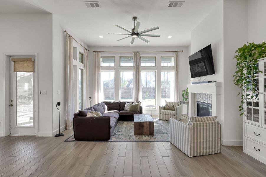 Floor-to-ceiling windows wrap the living room in light Floor-to-ceiling windows wrap the living room in light