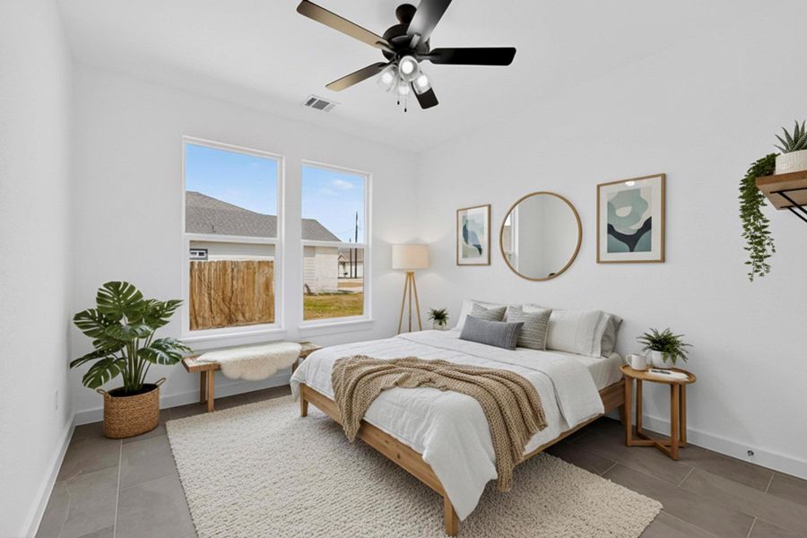 Bedroom featuring baseboards and a ceiling fan