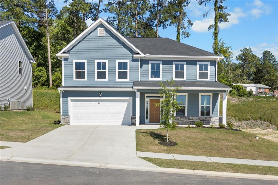 Front exterior of a new home in Forrest Bluff, North Augusta, SC, highlighting curb appeal (Image 1). Front exterior of a new home in Forrest Bluff, North Augusta, SC, highlighting curb appeal (Image 1).