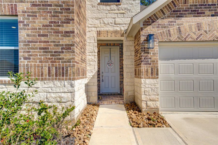 Front exterior of a new home in Fairwater, Montgomery, TX, highlighting curb appeal (Image 20). Front exterior of a new home in Fairwater, Montgomery, TX, highlighting curb appeal (Image 20).