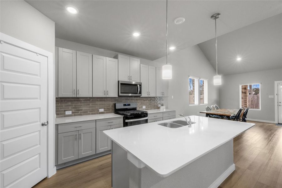 Modern and functional kitchen featuring generous counter space, ample cabinetry, and a practical layout ideal for both daily cooking and hosting guests. The kitchen seamlessly connects to the main living areas for easy interaction.
