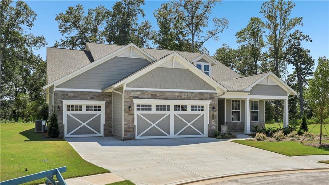 Front exterior of a new home in Cresswind Georgia at Twin Lakes, Hoschton, GA, highlighting curb appeal (Image 2).