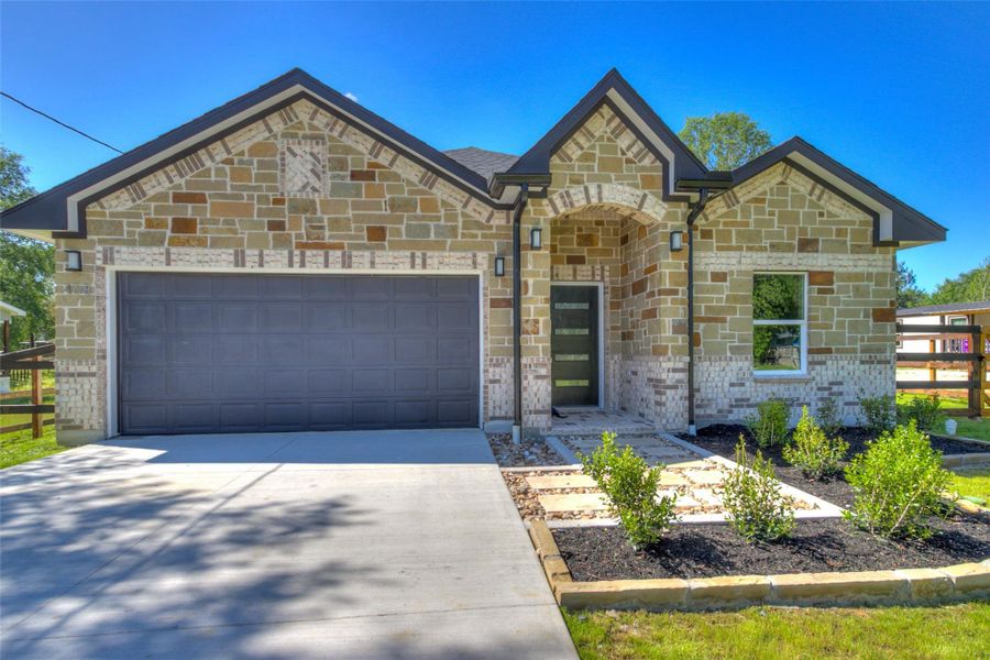 Front exterior of a new home in , Cleveland, TX, highlighting curb appeal (Image 19). Front exterior of a new home in , Cleveland, TX, highlighting curb appeal (Image 19).