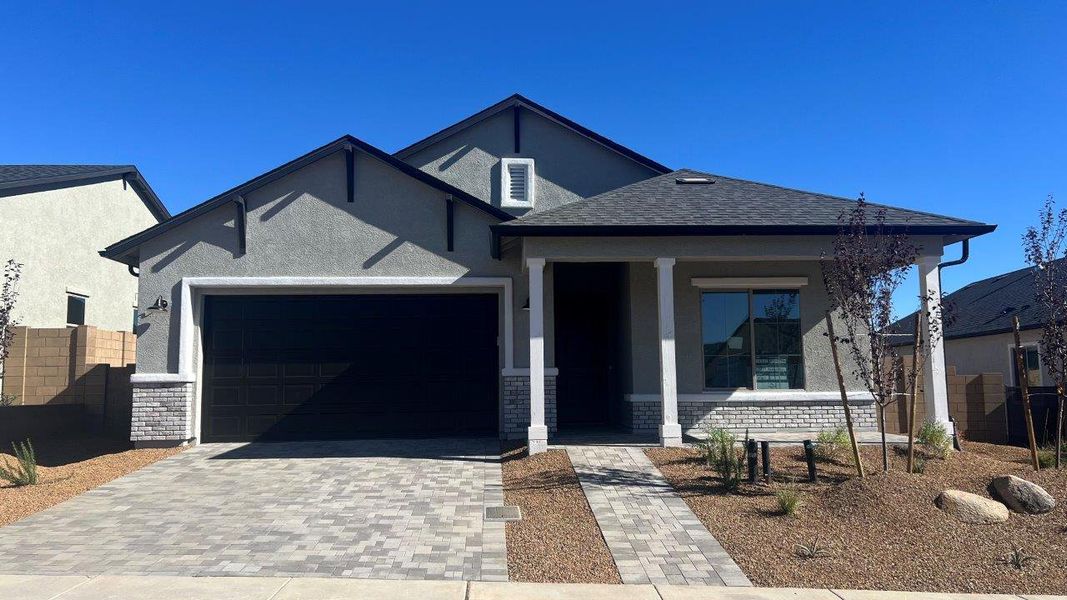 Front exterior of a new home in Horizon at The Dells, Prescott, AZ, highlighting curb appeal (Image 1).