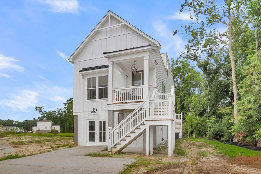 Front exterior of a new home in Heron Preserve, Hanahan, SC, highlighting curb appeal (Image 26). Front exterior of a new home in Heron Preserve, Hanahan, SC, highlighting curb appeal (Image 26).