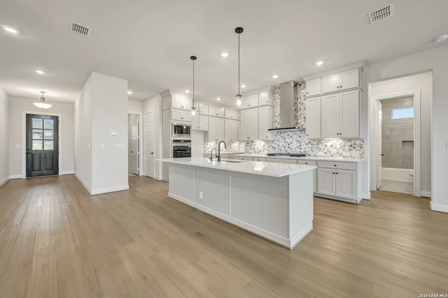 Furnished interior view inside a new home in Megans Landing – Half-Acre Homesites, Castroville (Image 13).