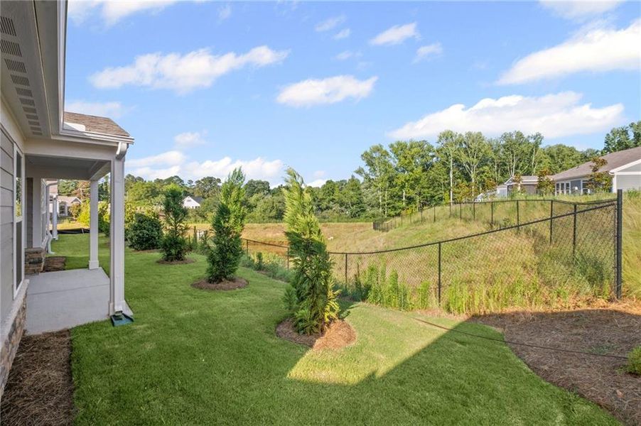 Front exterior of a new home in Laurel Farms, Dallas, GA, highlighting curb appeal (Image 32). Front exterior of a new home in Laurel Farms, Dallas, GA, highlighting curb appeal (Image 32).
