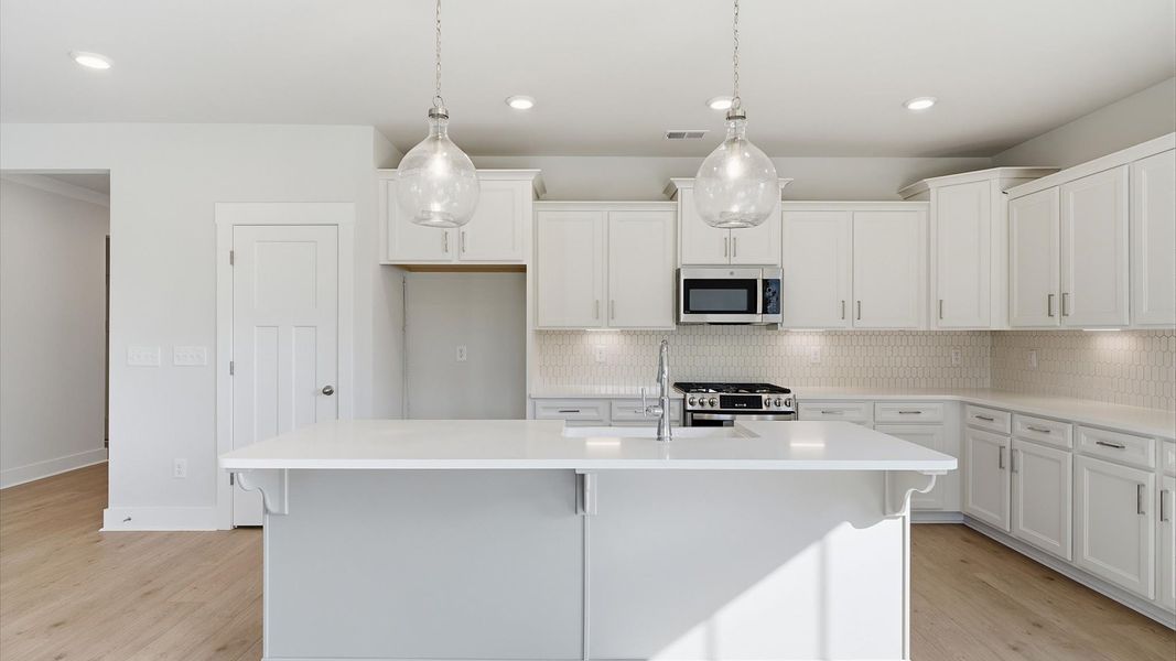 Superior craftsmanship shines in this modern kitchen with a space-saving island and open flow in Seneca, SC