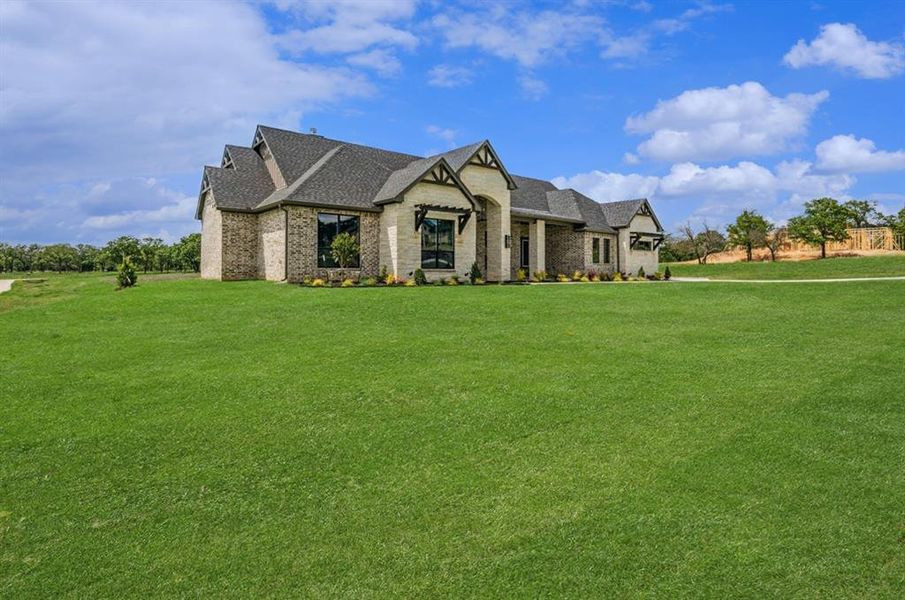 Front exterior of a new home in , Weatherford, TX, highlighting curb appeal (Image 25). Front exterior of a new home in , Weatherford, TX, highlighting curb appeal (Image 25).