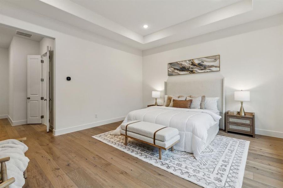 Bedroom with light hardwood / wood-style flooring