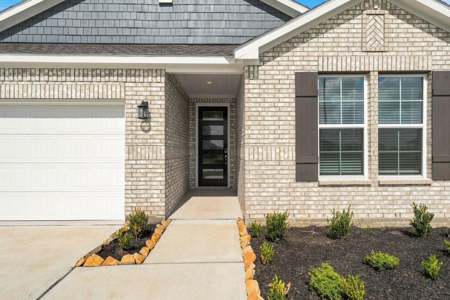 Exterior details and patio area of a home in Sunterra Lakes, Brookshire (Image 3). Exterior details and patio area of a home in Sunterra Lakes, Brookshire (Image 3).